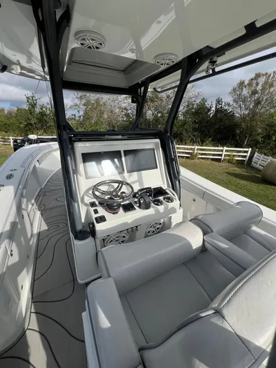  Yacht Photos Pics 2019 Yellowfin 36 Offshore boat interior with steering console and seating.