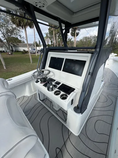  Yacht Photos Pics 2019 Yellowfin 36 Offshore boat cockpit with dual screens and modern controls.