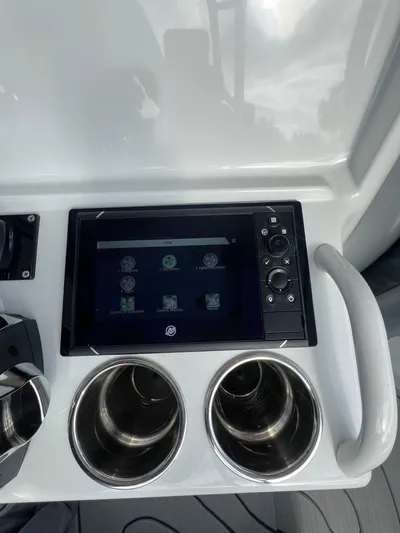  Yacht Photos Pics 2019 Yellowfin 36 Offshore boat console with touchscreen and cup holders.