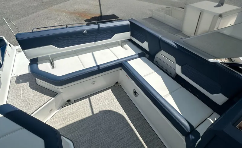 Yacht Photos Pics 2022 Cobalt A29 boat interior with blue and white seating arrangement.
