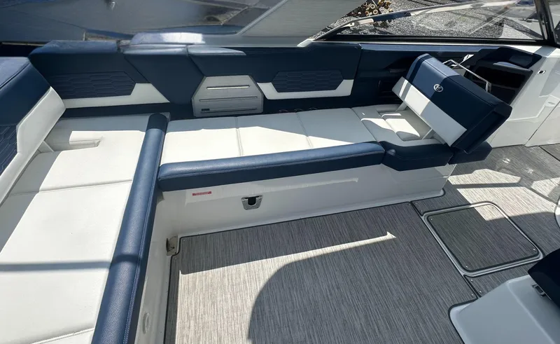 Yacht Photos Pics 2022 Cobalt A29 boat interior with blue and white seating, modern design.