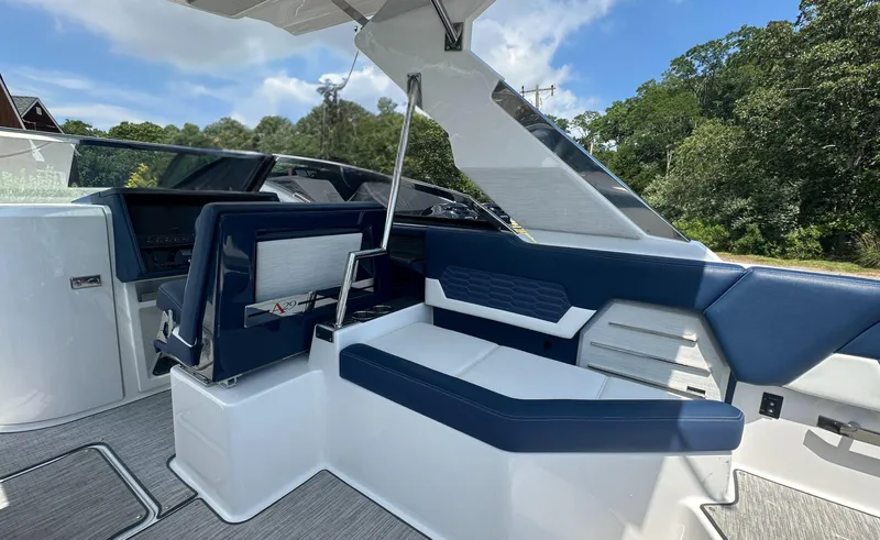  Yacht Photos Pics 2022 Cobalt A29 boat interior with blue and white seating, modern design.