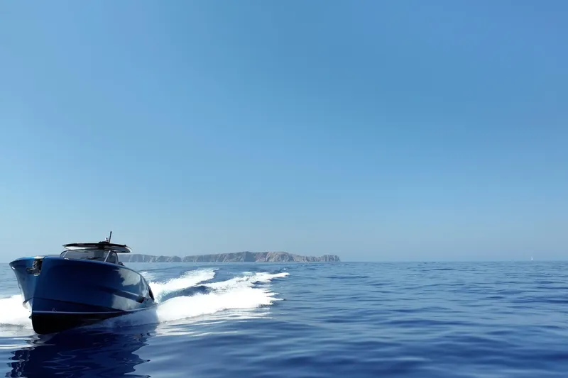 Aegean Infinity Yacht Photos Pics 2023 Solaris Power 44 Open yacht cruising on calm blue sea.