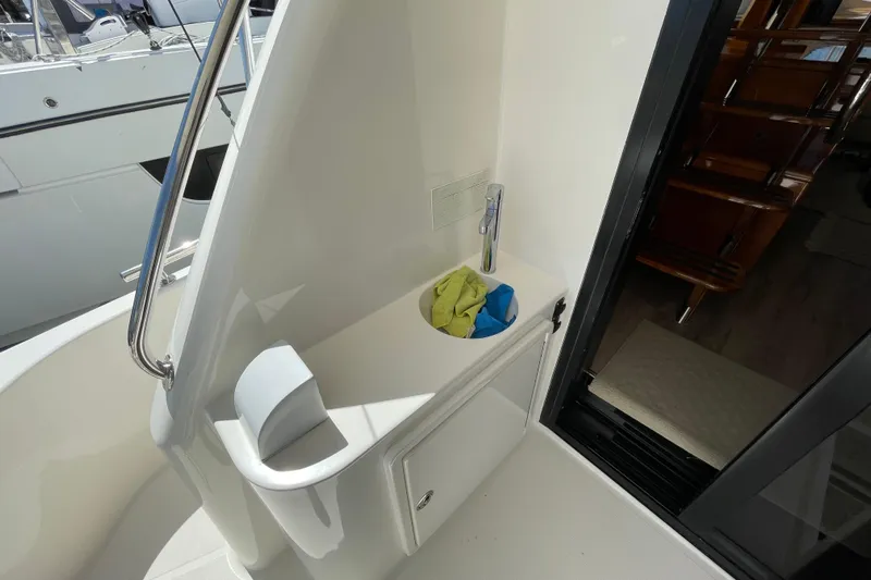  Yacht Photos Pics 2011 Maritimo 56 Cruising Motoryacht interior with sink and handrail detail.