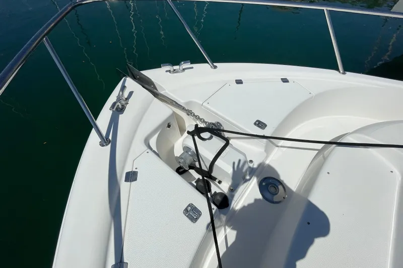  Yacht Photos Pics Bow of 2011 Maritimo 56 Cruising Motoryacht with anchor and railing.