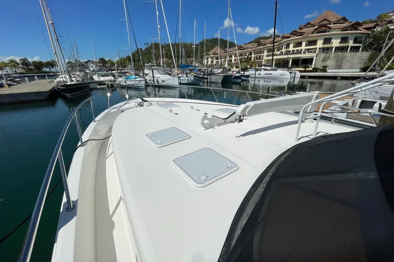  Yacht Photos Pics 2011 Maritimo 56 Cruising Motoryacht docked in a scenic marina.