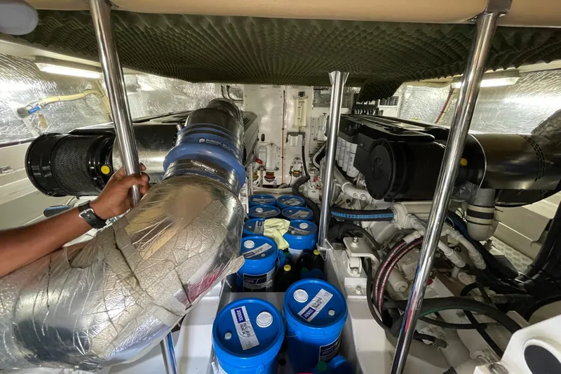  Yacht Photos Pics Engine room of 2011 Maritimo 56 Cruising Motoryacht with visible components and insulation.
