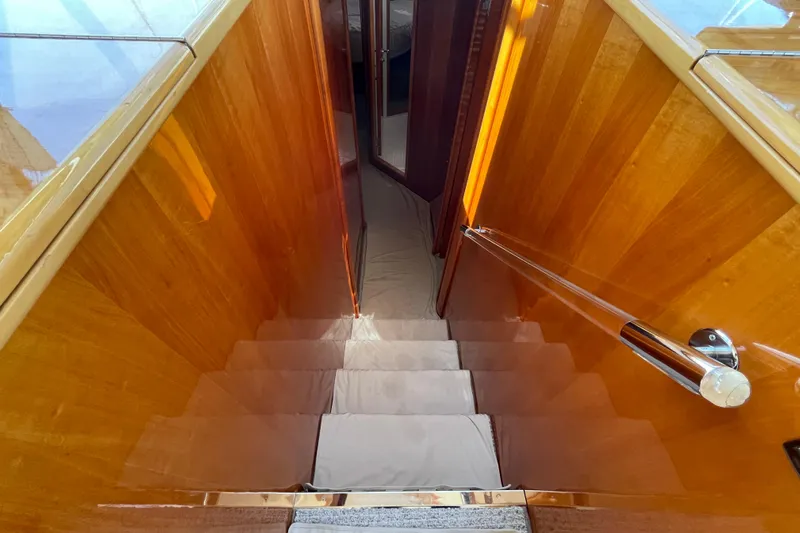  Yacht Photos Pics Staircase inside 2011 Maritimo 56 Cruising Motoryacht with polished wood finish.