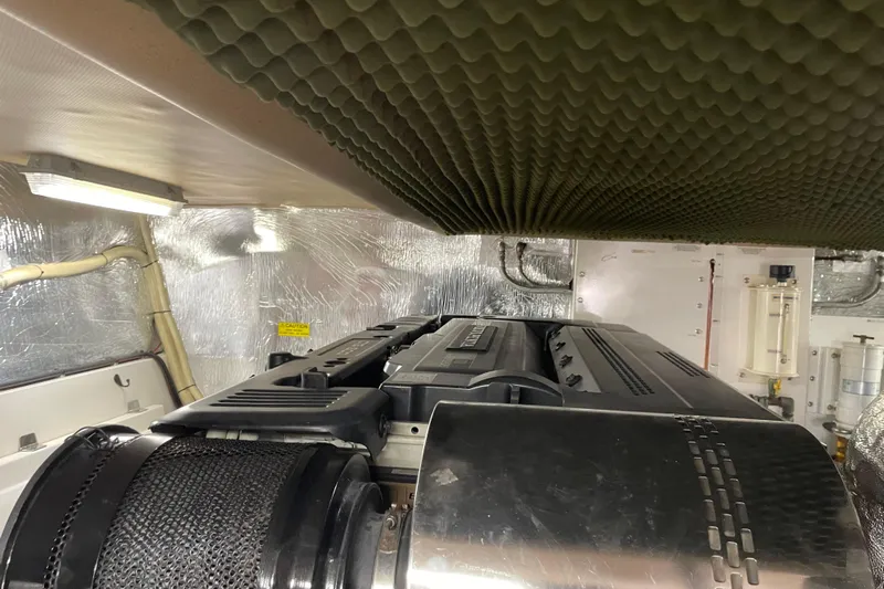  Yacht Photos Pics Engine room of 2011 Maritimo 56 Cruising Motoryacht with soundproofing and machinery.