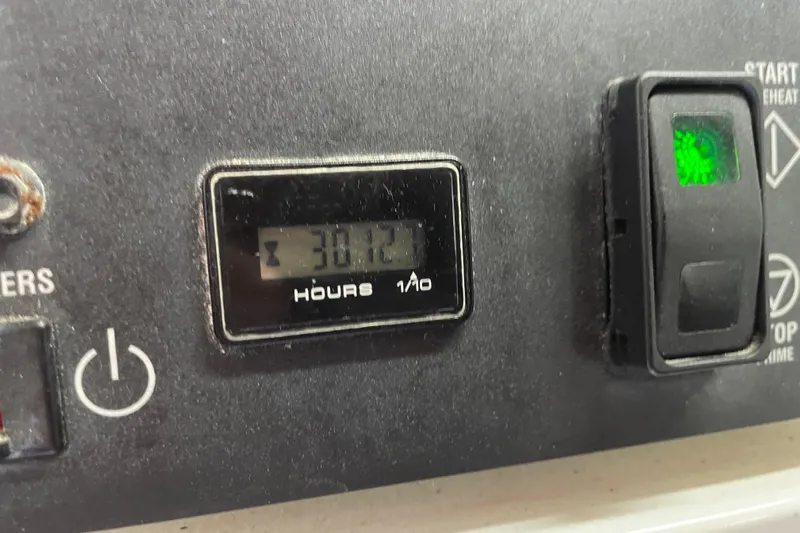  Yacht Photos Pics Hour meter showing 3012 hours on 2011 Maritimo 56 Cruising Motoryacht dashboard.