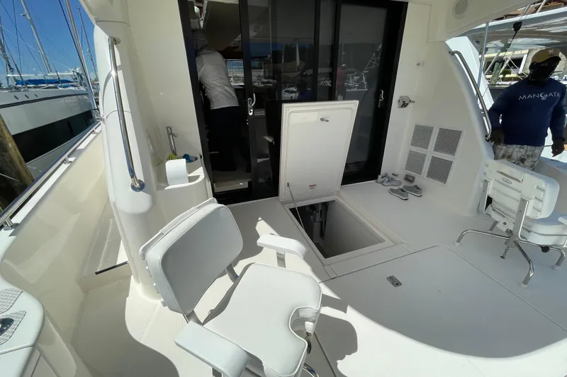  Yacht Photos Pics 2011 Maritimo 56 Cruising Motoryacht deck with seating and open hatch.