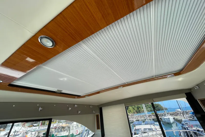  Yacht Photos Pics Interior ceiling of 2011 Maritimo 56 Cruising Motoryacht with wood trim and lighting.
