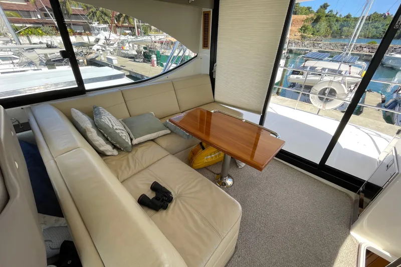  Yacht Photos Pics Luxurious interior of 2011 Maritimo 56 Cruising Motoryacht with leather seating and wooden table.