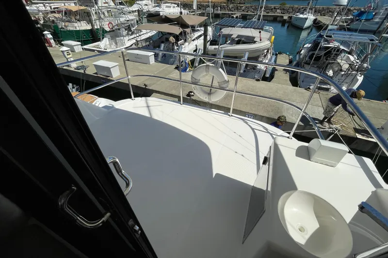  Yacht Photos Pics 2011 Maritimo 56 Cruising Motoryacht docked at marina with other boats.