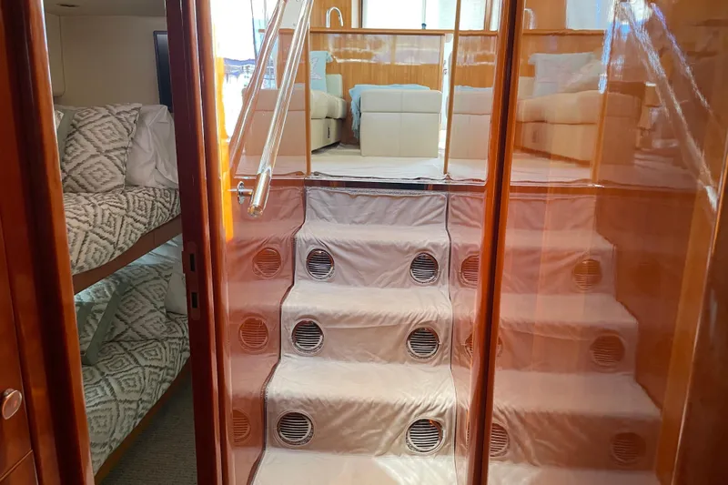  Yacht Photos Pics Interior of 2011 Maritimo 56 Cruising Motoryacht with stairs and cozy cabin.