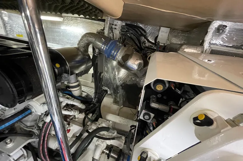  Yacht Photos Pics Engine room of 2011 Maritimo 56 Cruising Motoryacht with visible components and wiring.