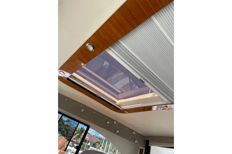  Yacht Photos Pics Interior view of 2011 Maritimo 56 Cruising Motoryacht skylight with wooden trim.