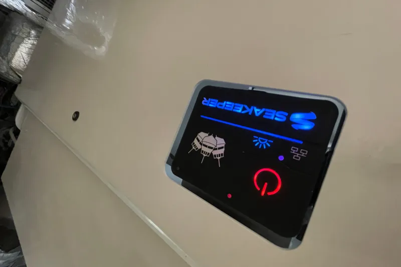  Yacht Photos Pics Control panel on 2011 Maritimo 56 Cruising Motoryacht, featuring illuminated Seakeeper display.