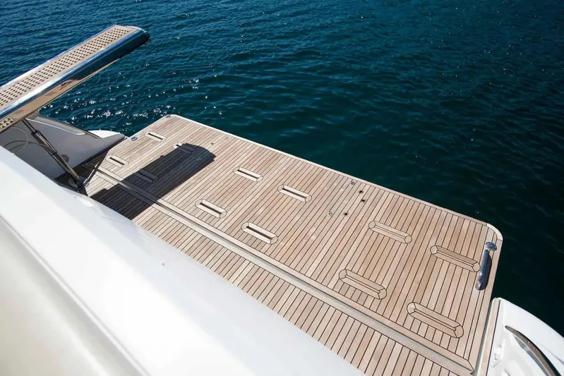 My Laura Yacht Photos Pics Luxury yacht Azimut Fly 60, 2015 model, featuring a spacious teak deck by the sea.