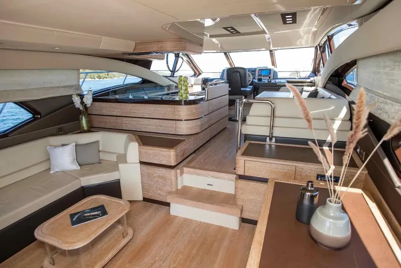 My Laura Yacht Photos Pics Luxurious interior of 2015 Azimut Fly 60 yacht with modern furnishings and panoramic windows.