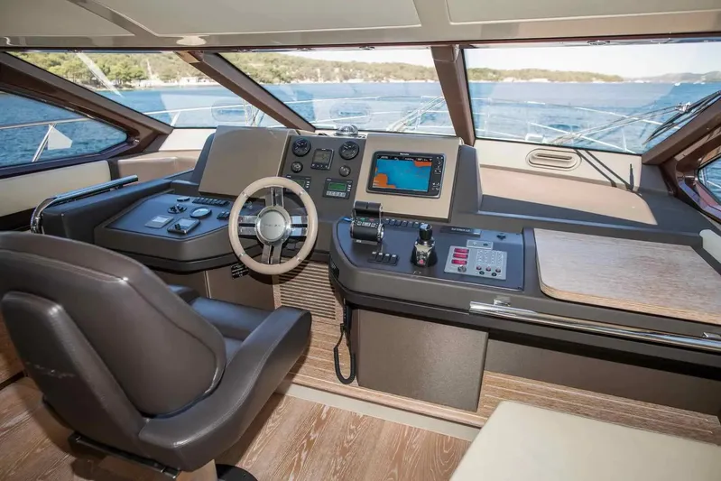 My Laura Yacht Photos Pics Cockpit of 2015 Azimut Fly 60 yacht with modern navigation controls and panoramic view.