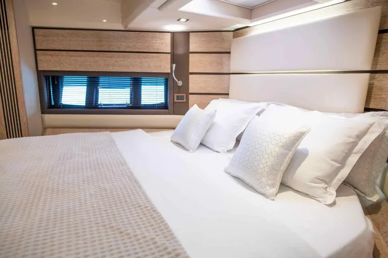 My Laura Yacht Photos Pics Luxurious bedroom interior of 2015 Azimut Fly 60 yacht with elegant bedding and window view.