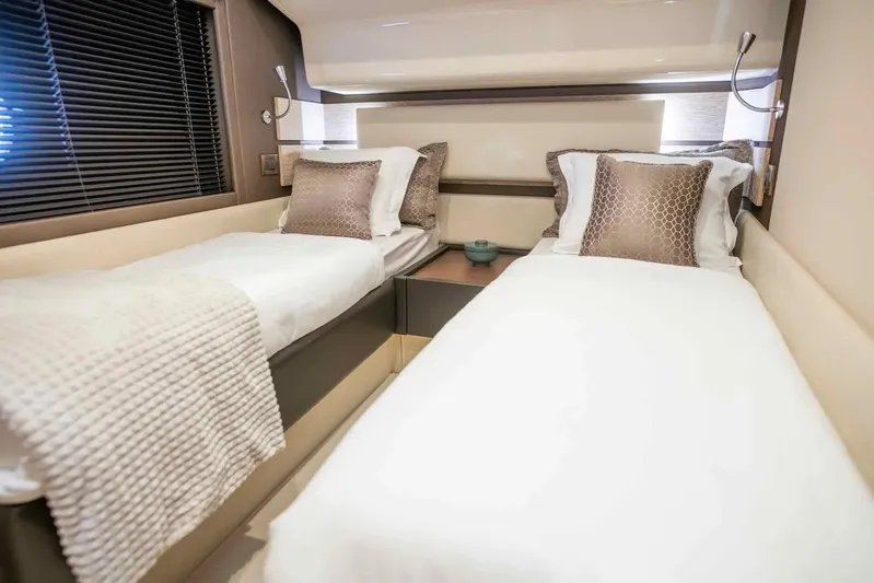 My Laura Yacht Photos Pics Luxurious twin cabin interior on 2015 Azimut Fly 60 yacht, featuring elegant bedding and decor.