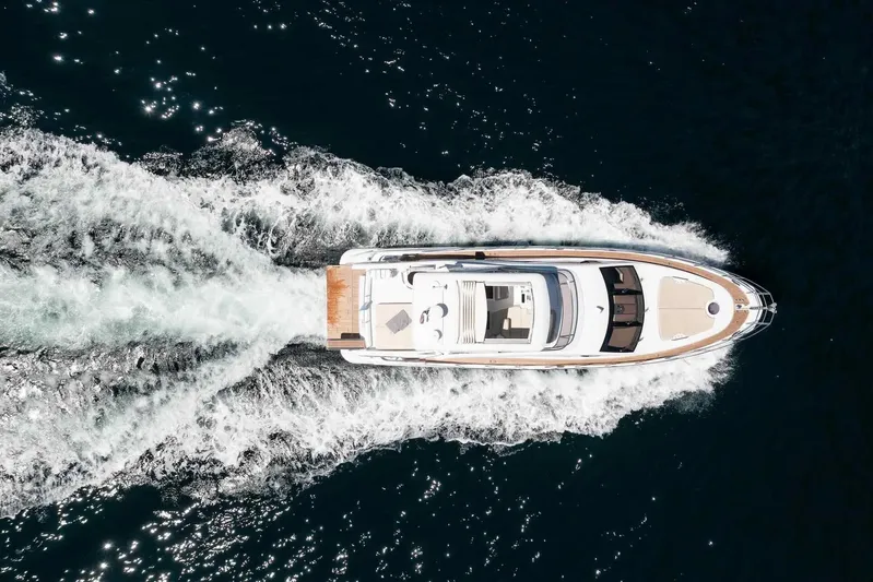 My Laura Yacht Photos Pics Aerial view of 2015 Azimut Fly 60 yacht cruising on open water.