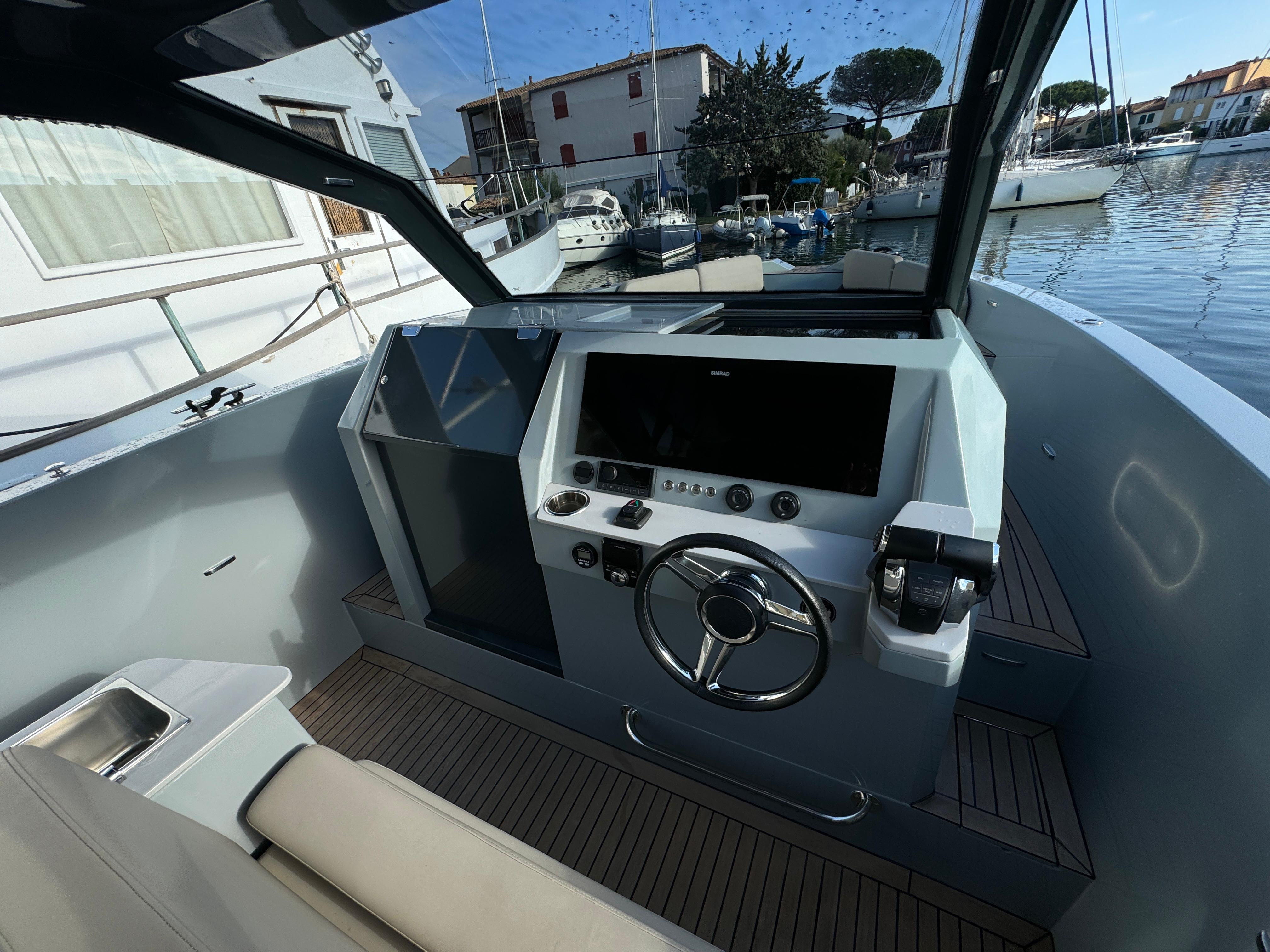 Modern 2022 Rand Escape 30 boat cockpit with sleek design and advanced navigation controls.