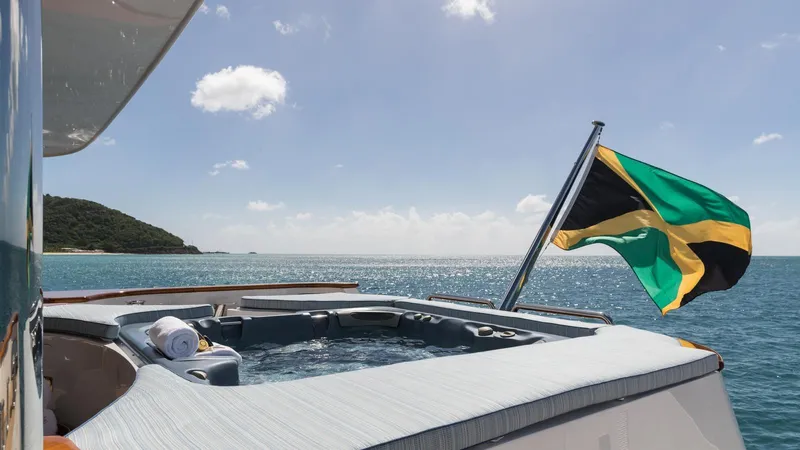 Touch Yacht Photos Pics Luxury yacht with hot tub and Jamaican flag, Custom Louisbourg 2004 model, ocean view.