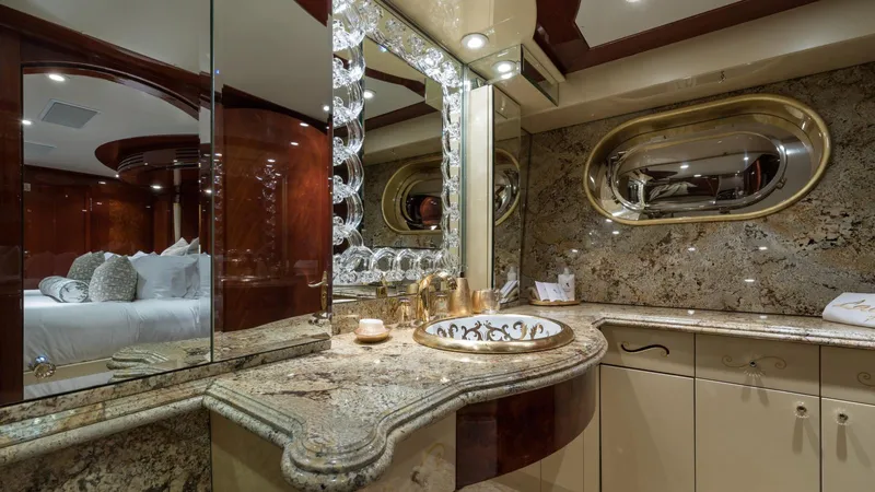 Touch Yacht Photos Pics Luxurious yacht bathroom with marble countertops, elegant fixtures, and mirrored accents, Custom Louisbourg 2004.