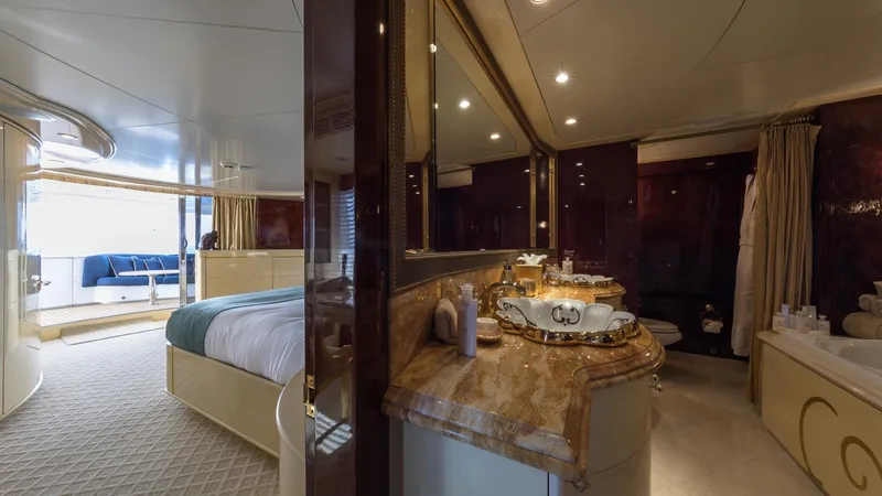 Touch Yacht Photos Pics Luxurious yacht interior with elegant bedroom and marble-accented bathroom, Custom Louisbourg 2004 model.