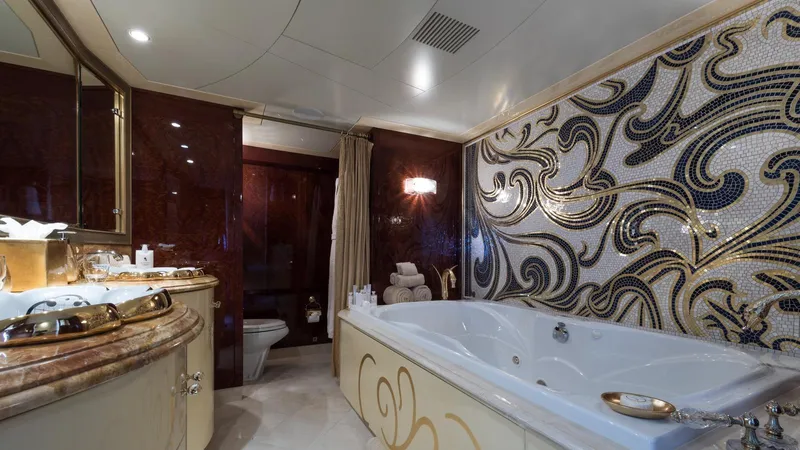 Touch Yacht Photos Pics Luxurious yacht bathroom with mosaic wall, large bathtub, and elegant fixtures, Custom Louisbourg 2004.