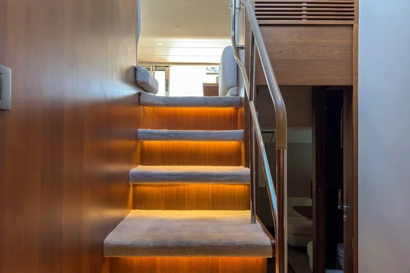  Yacht Photos Pics Staircase with ambient lighting inside a 2019 Princess F55 yacht.