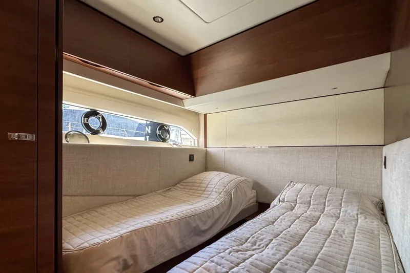  Yacht Photos Pics Luxurious twin cabin interior of 2019 Princess F55 yacht with modern design.