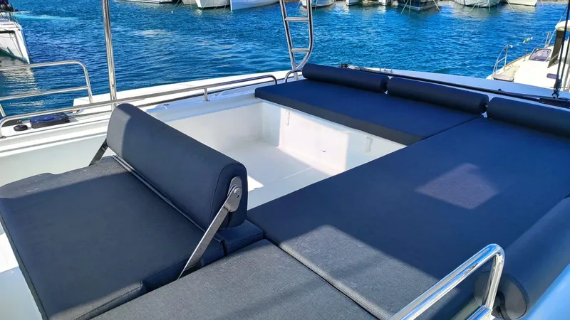  Yacht Photos Pics 2024 Lagoon 51 yacht with spacious sunbathing area and sleek design.