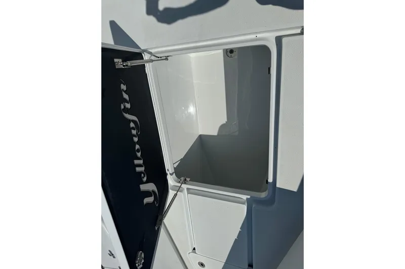  Yacht Photos Pics Open storage compartment on 2024 Yellowfin 39 Offshore boat, showcasing interior space.