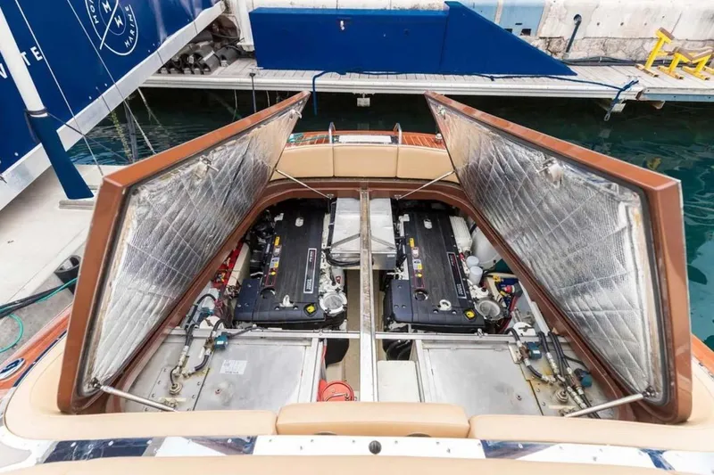 Visionnaire Yacht Photos Pics Open engine compartment of 2010 J Craft Torpedo 42 boat at dock.