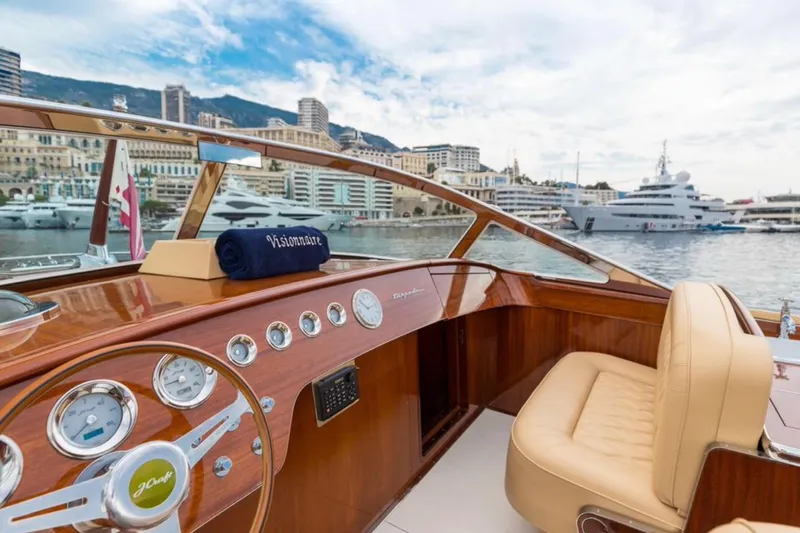 Visionnaire Yacht Photos Pics Luxurious 2010 J Craft Torpedo 42 yacht interior with elegant wood finish and cityscape view.
