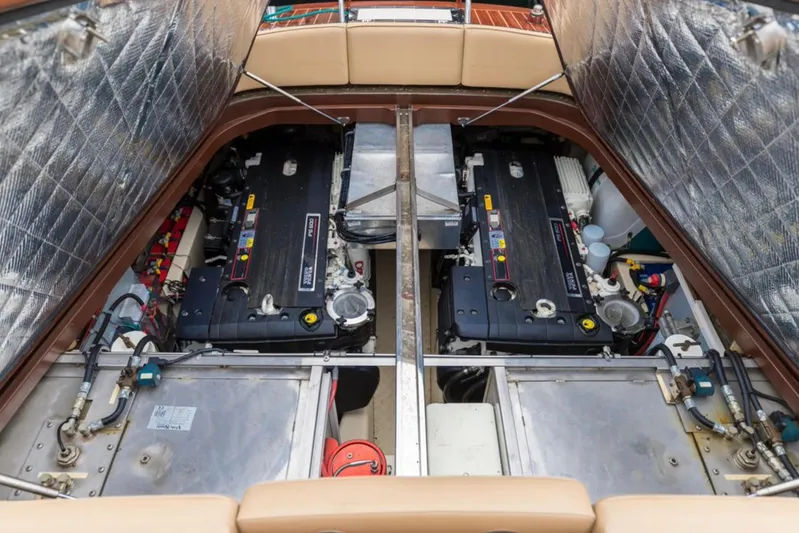 Visionnaire Yacht Photos Pics Engine compartment of 2010 J Craft Torpedo 42, showcasing dual engines and mechanical components.