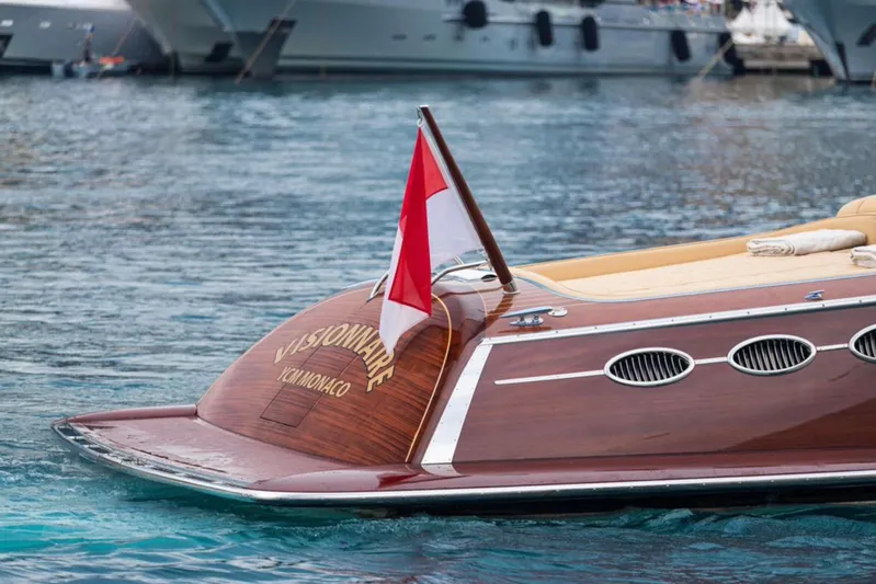 Visionnaire Yacht Photos Pics Luxury J Craft Torpedo 42 yacht, 2010 model, docked with Monaco flag.