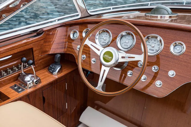 Visionnaire Yacht Photos Pics Luxurious 2010 J Craft Torpedo 42 boat dashboard with wooden finish and classic gauges.
