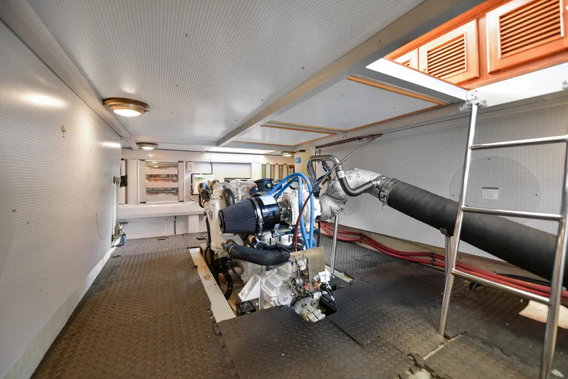 Island Harmony Yacht Photos Pics Engine room of 2012 North Pacific NP 38 Sedan with visible machinery and ladder.