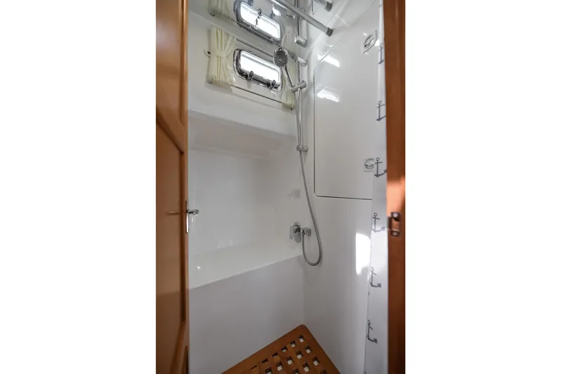 Island Harmony Yacht Photos Pics Shower area in 2012 North Pacific NP 38 Sedan yacht with wooden accents.