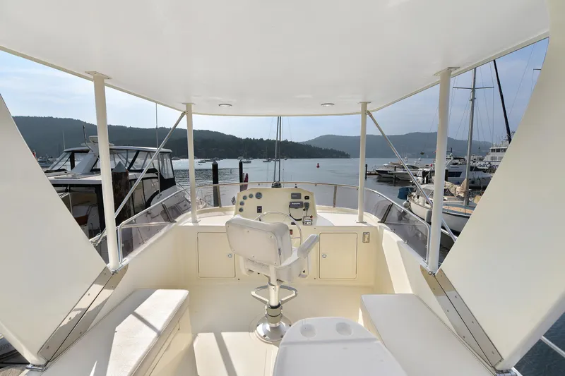 Island Harmony Yacht Photos Pics Flybridge view of 2012 North Pacific NP 38 Sedan yacht in a marina setting.