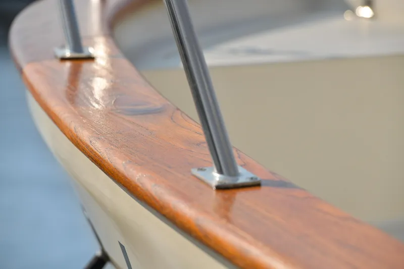 Island Harmony Yacht Photos Pics Close-up of 2012 North Pacific NP 38 Sedan's polished wooden railing.