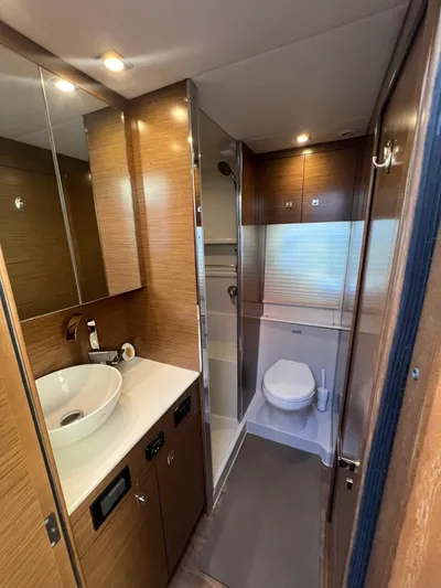  Yacht Photos Pics Luxurious bathroom in 2018 Cruisers Yachts 42 Cantius, featuring modern fixtures and wood accents.