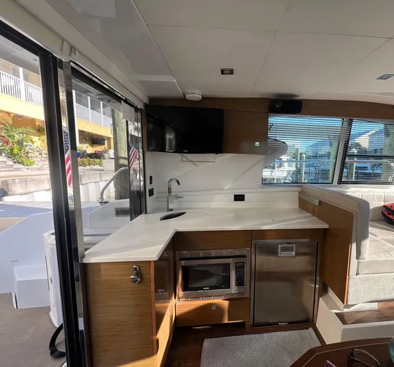  Yacht Photos Pics Interior of 2018 Cruisers Yachts 42 Cantius with modern kitchen and sleek design.
