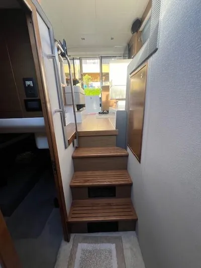  Yacht Photos Pics 2018 Cruisers Yachts 42 Cantius interior with wooden steps and modern design.