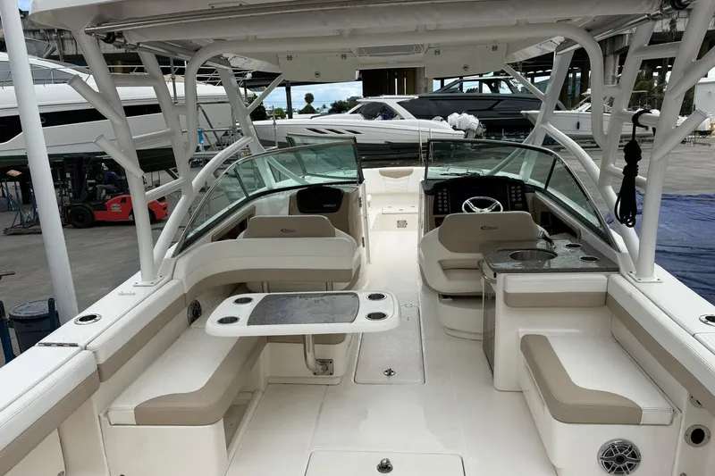  Yacht Photos Pics 2024 Robalo R317 Dual Console boat interior with seating and helm station.